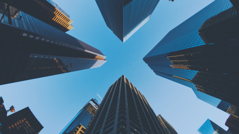 An aerial view of waves crashing against a shore.