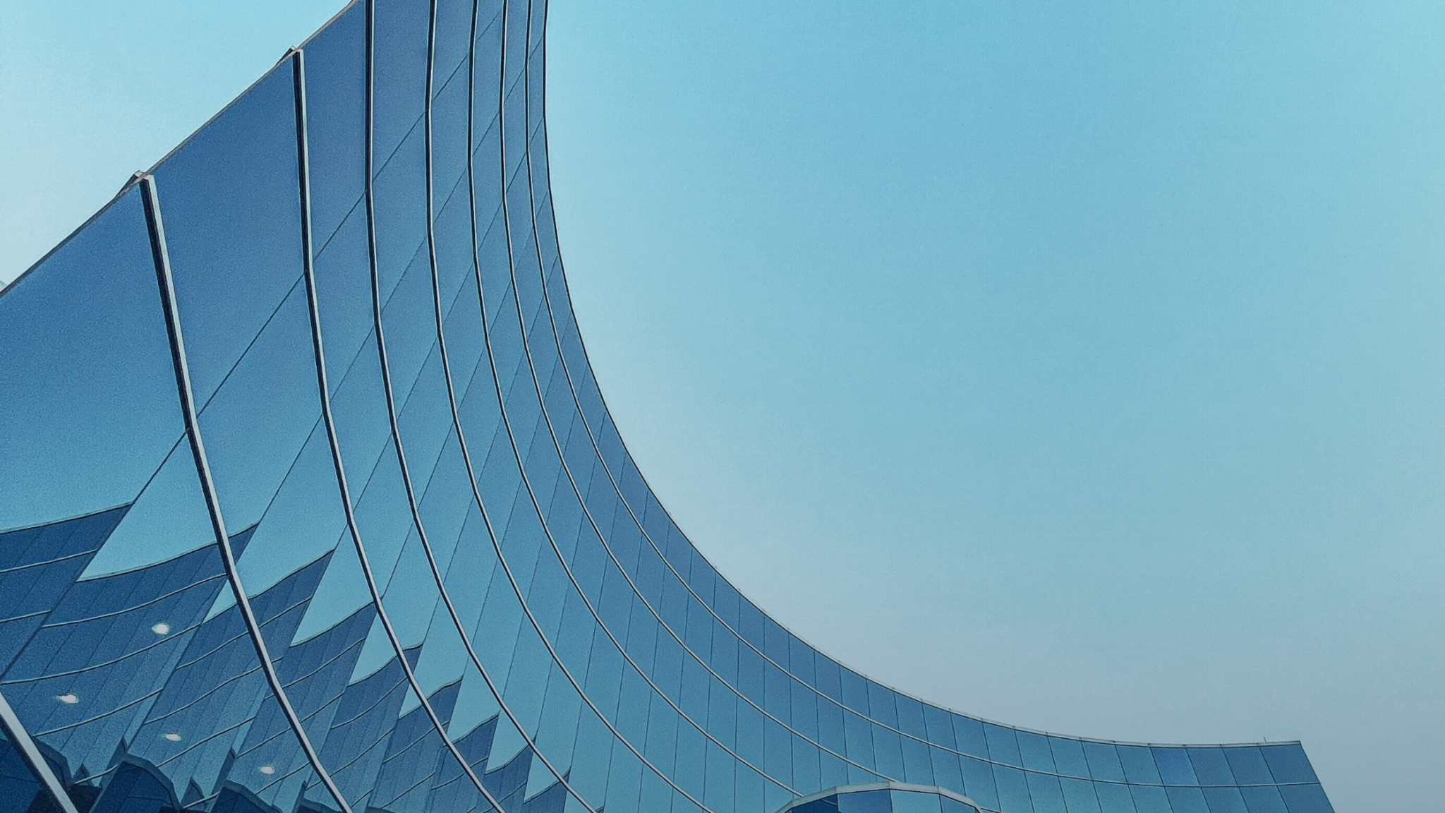 An aerial view of a field. A road runs through the upper right corner.